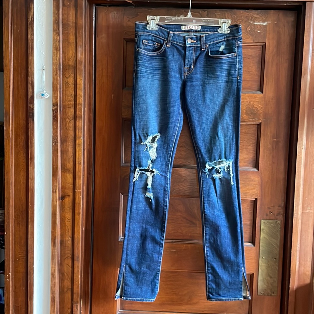 J Brand Pencil with side rip and front leg tear jeans.